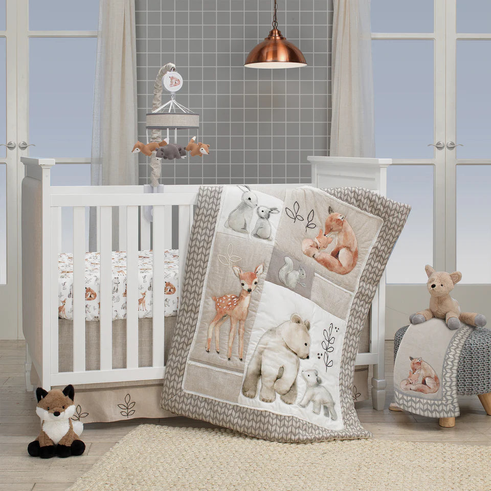 Nursery with white crib, animal-themed bedding, and stuffed toys.